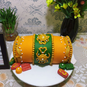 Orange Dhol Shape Fondant Cake Orange Dhol Shape Fondant Cake