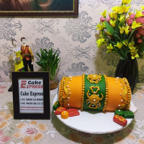 Orange Dhol Shape Fondant Cake in Noida