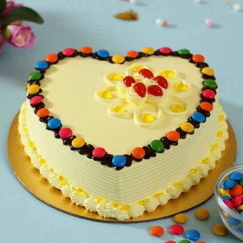 Heart Shaped Butterscotch Gems Cake Delivery in Noida