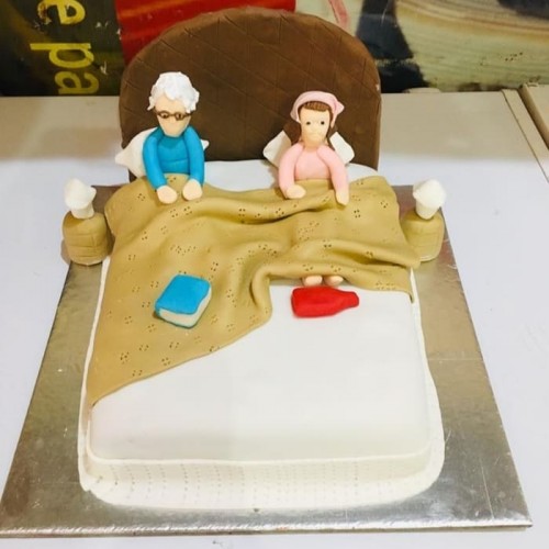 Old Parents in Bed Theme Cake Delivery in Noida